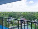 Relax on the balcony with stunning views of the lush green landscape and cityscape beyond at 2780 N Riverside Dr # 802, Tampa, FL 33602