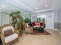 Inviting lobby area with comfortable seating, mirrored walls and plant decor providing a welcoming atmosphere at 2780 N Riverside Dr # 802, Tampa, FL 33602