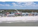 Expansive view of the beachfront home, nestled between the tranquil bay and the serene ocean waters at 36 Gulf Blvd # 3, Indian Rocks Beach, FL 33785