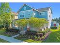 Beautiful two-story home with a cozy front porch, manicured landscaping, and appealing curb appeal at 6011 Caldera Ridge Dr, Lithia, FL 33547