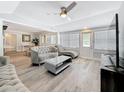 Comfortable living room showcasing stylish decor, hardwood floors, and a ceiling fan at 6609 Dartmouth N Ave, St Petersburg, FL 33710