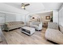 Bright living room featuring modern furnishings and a ceiling fan for optimal airflow at 6609 Dartmouth N Ave, St Petersburg, FL 33710