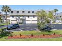 Inviting two-story townhome with private garages, balconies, and lush landscaping in a desirable location at 12485 2Nd E St # C103, Treasure Island, FL 33706