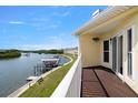 Stunning balcony view overlooking the waterway and boat docks on a bright, sunny day at 140 Brent Cir, Oldsmar, FL 34677