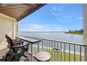 Balcony seating area featuring scenic waterfront views and railing at 140 Brent Cir, Oldsmar, FL 34677