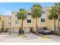 Inviting two-story townhome with mature landscaping and attached two-car garage at 140 Brent Cir, Oldsmar, FL 34677