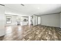 Bright open living space featuring modern flooring, stainless appliances and natural light at 14383 Dehaven Ave, Brooksville, FL 34613