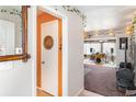 Entryway to a cozy living room with a neutral color scheme at 1528 Chevy Chase Dr, Sun City Center, FL 33573
