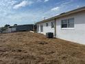 Spacious backyard with room for activities, showcasing the property's outdoor potential at 21811 Edgewater Dr, Port Charlotte, FL 33952