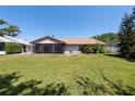 Spacious backyard with lush green lawn at 3330 Foxridge Cir, Tampa, FL 33618