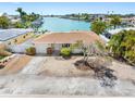 Charming single-story home with a well-maintained front yard and water views at 455 115Th Ave, Treasure Island, FL 33706