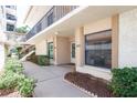Inviting entrance to unit 103 with well-kept landscaping and easy access to the upper levels via the stairs at 6279 Sun Blvd # 103, St Petersburg, FL 33715