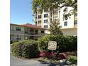 Casa V Condo main entrance showcases lush landscaping and a welcoming sign for residents and guests at 6279 Sun Blvd # 103, St Petersburg, FL 33715