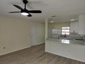 Inviting living area featuring laminate flooring and recessed lighting at 6646 Del Prado Ter, New Port Richey, FL 34652