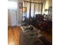 Bright living room with hardwood floors, comfortable seating, and natural light at 7435 46Th N Ave, St Petersburg, FL 33709
