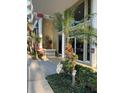 Condo building entrance showing lush landscaping with greenery surrounding the entrance at 750 4Th S Ave # 403C, St Petersburg, FL 33701