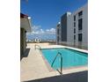 Rooftop swimming pool area with city views and lounge seating on a sunny day at 750 4Th S Ave # 403C, St Petersburg, FL 33701