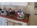 Close-up of kitchen counter with white cabinets and assortment of various items at 9950 Morris Bridge, Tampa, FL 33637