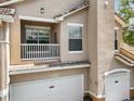 Close up exterior image showcasing the architectural details, balcony and garage of the building at 10434 Villa View Cir, Tampa, FL 33647