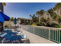 Relaxing patio with lounge chairs offering peaceful views of the surrounding landscape at 11531 Shipwatch Dr # 1030, Largo, FL 33774