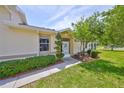 Cozy front entrance with well-maintained landscaping and a welcoming atmosphere at 1216 Lyndhurst Greens Dr, Sun City Center, FL 33573