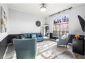 Inviting living room with a large window, plush seating, and stylish decor, perfect for relaxation and entertaining at 20203 Merry Oak Ave, Tampa, FL 33647