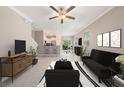 Inviting living room featuring modern decor, open floor plan, and bright natural light at 23378 Papyrus Way, Lutz, FL 33549