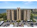 Condominium building showing parking spaces with covered parking with view of Tampa Bay at 2616 Cove Cay Dr # 803, Clearwater, FL 33760