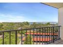 Balcony view of the water and carports in the distance, highlighting outdoor living at 2699 Seville Blvd # 805, Clearwater, FL 33764
