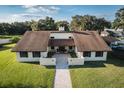 Attractive home showcasing well-maintained landscaping and a welcoming walkway to the front door at 2780 E Sam Allen Rd, Plant City, FL 33565