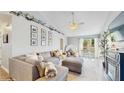Bright living room with vaulted ceilings, large sectional sofa, and adjacent breakfast nook area at 3238 6Th W Ave, Palmetto, FL 34221