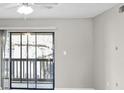 A bright living room with sliding glass doors that lead out to a patio at 3706 Greenery Ct # 206, Tampa, FL 33618
