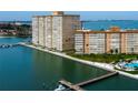 Exterior of a modern high-rise condominium complex with waterfront access and a pool at 5200 Brittany S Dr # 204, St Petersburg, FL 33715