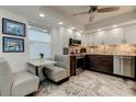 Modern kitchen with stainless steel appliances, white and gray cabinets, and eat-in nook at 5200 Brittany S Dr # 204, St Petersburg, FL 33715