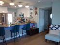 Modern kitchen with stainless steel appliances, breakfast bar and bright lighting at 5413 S Martin Ave, Tampa, FL 33611