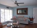 Cozy living room featuring a comfortable sectional sofa and stylish decor at 5413 S Martin Ave, Tampa, FL 33611