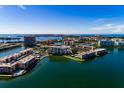 Aerial view of condos and waterfront neighborhood with bay access at 7700 Sun Island S Dr # 506, South Pasadena, FL 33707