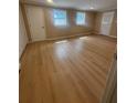 Bright and airy bedroom featuring two windows, wood floors, and two closets at 816 Drane Nw St, Plant City, FL 33563