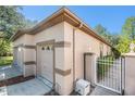 Exterior view of the home with a gated entrance, showcasing the well-maintained landscaping at 7519 Berna Ln, Land O Lakes, FL 34637