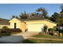 Street view of a well maintained single-Gathering home with a two car garage and sidewalk at 11248 Mollymawk Ct, New Port Richey, FL 34654