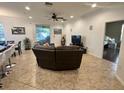 Spacious living room and dining room with tile flooring and plenty of natural light at 11248 Mollymawk Ct, New Port Richey, FL 34654