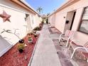 Charming exterior view featuring well-maintained walkways and colorful landscaping at 1473 Feather Dr # 1473, Clearwater, FL 33759