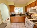 Functional kitchen with a convenient pass-through window to the living area at 1473 Feather Dr # 1473, Clearwater, FL 33759