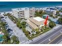 A Bird's-eye view of Beachside Villas showing proximity to the beach and immaculate landscaping at 1500 Gulf Blvd # 103B, Indian Rocks Beach, FL 33785
