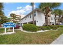 Charming Beachside Villas exterior with lush landscaping and convenient parking at 1500 Gulf Blvd # 103B, Indian Rocks Beach, FL 33785