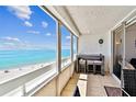 Breathtaking ocean views from the condo balcony with bar seating to enjoy beach views at 17940 Gulf Blvd # 9B, Redington Shores, FL 33708