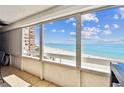 Enjoy breathtaking ocean views from this condo's private balcony featuring a sunny seating area at 17940 Gulf Blvd # 9B, Redington Shores, FL 33708
