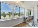 Enclosed lanai boasts large windows with stunning views of the golf course and blue sky at 2616 Cove Cay Dr # 301, Clearwater, FL 33760