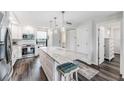 Bright kitchen with white cabinets, stainless steel appliances and a granite island with seating at 2621 Cove Cay Dr # 204, Clearwater, FL 33760
