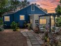 Outdoor seating area in a private backyard with mature landscaping and pavers at 3001 9Th N Ave, St Petersburg, FL 33713